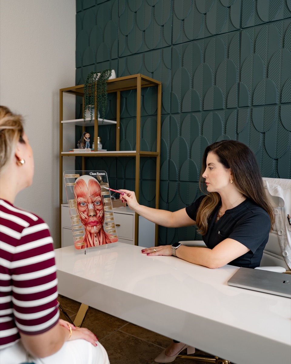 Chan Ramos discussing treatment plan with patient